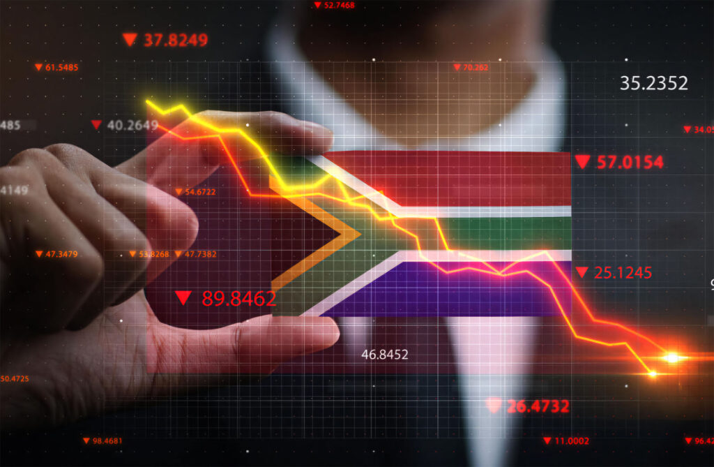 A person holds the South African flag with a descending stock market graph overlayed, symbolizing a decline in financial markets.